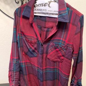 Plaid shirt with button back detail.